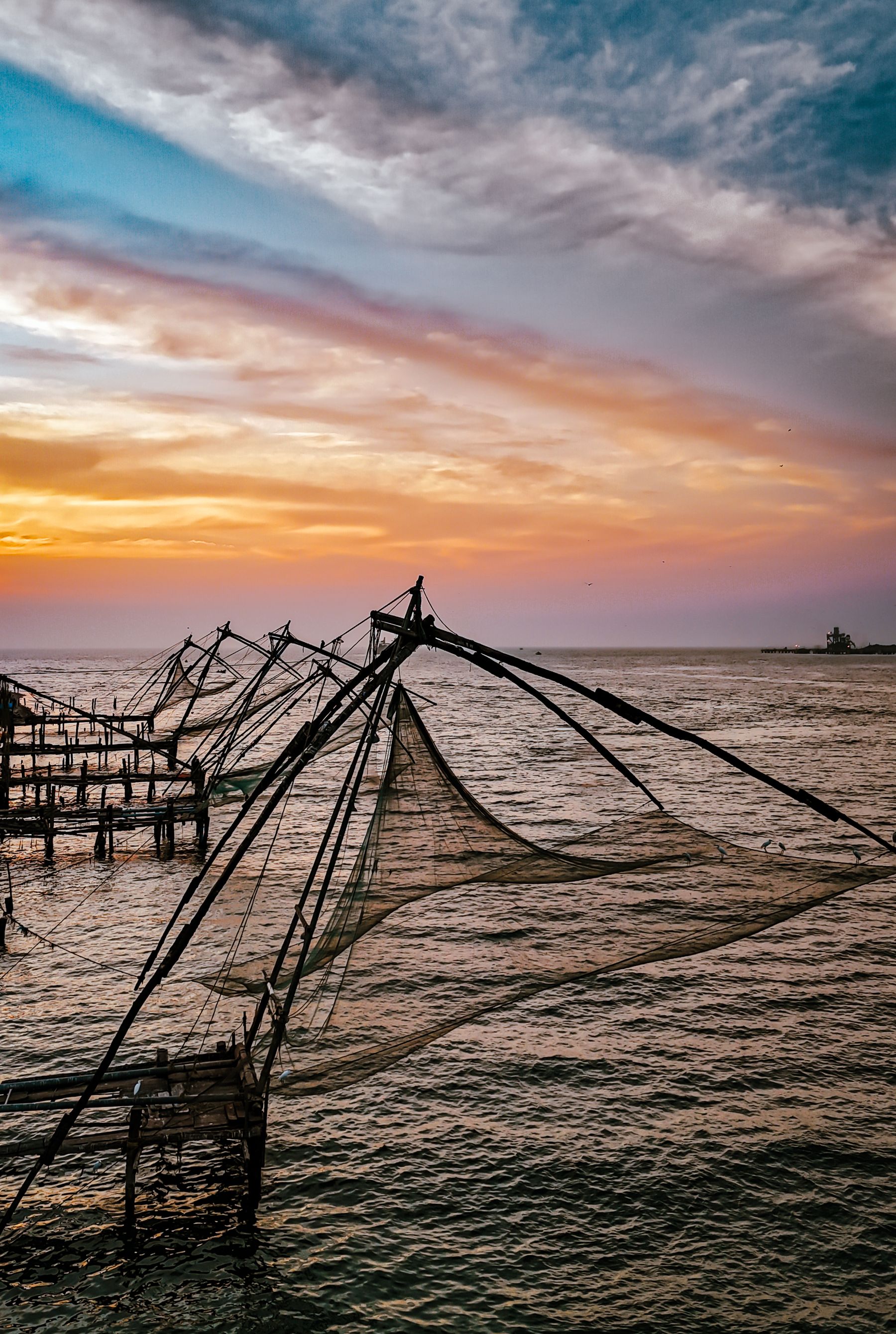 Chinese Fishing Nets With Wild Striped Sky